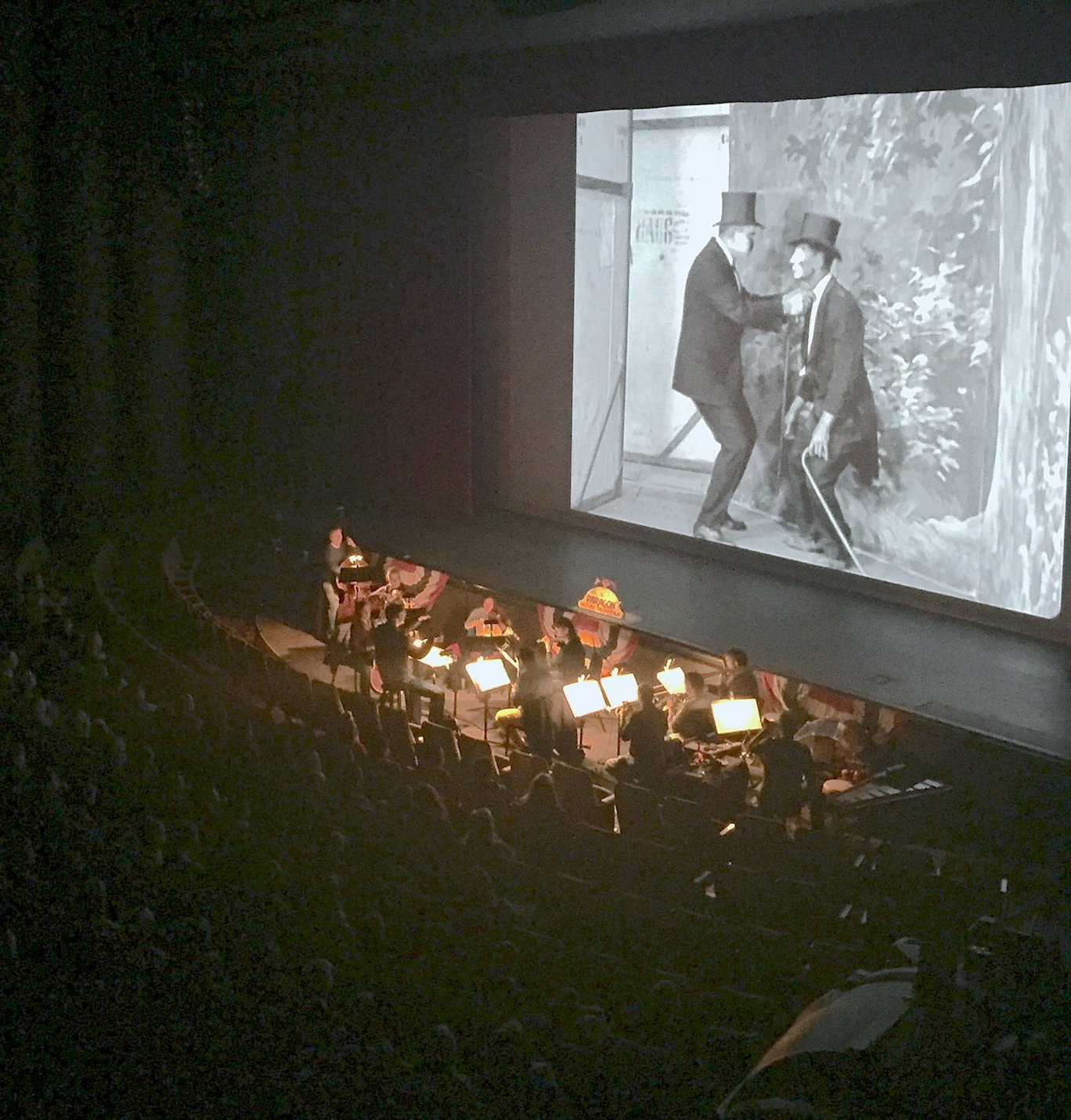 The Paragon Ragtime Orchestra accompanying a silent film at the Walton Arts Center.